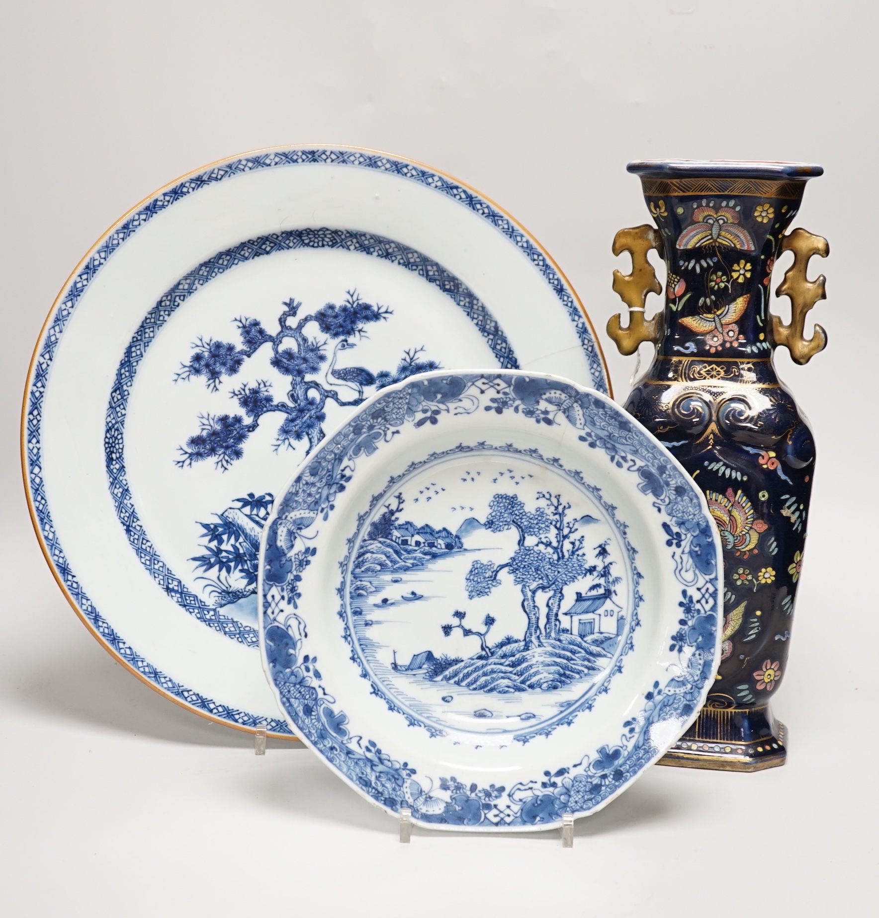 An 18th century Chinese export blue and white charger, a similar soup bowl and a late 19th century enamelled blue ground vase, 32cm